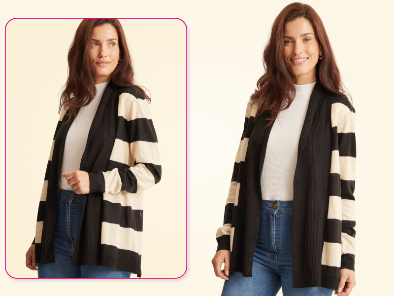 Mulher sorridente usando cardigan listrado preto e branco