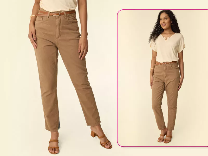 Modelo usando calça marrom e blusa clara