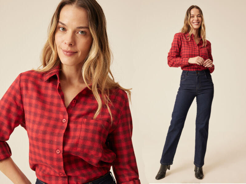 Modelo feminina com camisa xadrez vermelha e jeans
