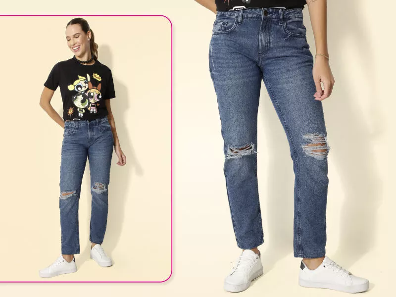 Modelo usando jeans rasgado e camiseta estilosa