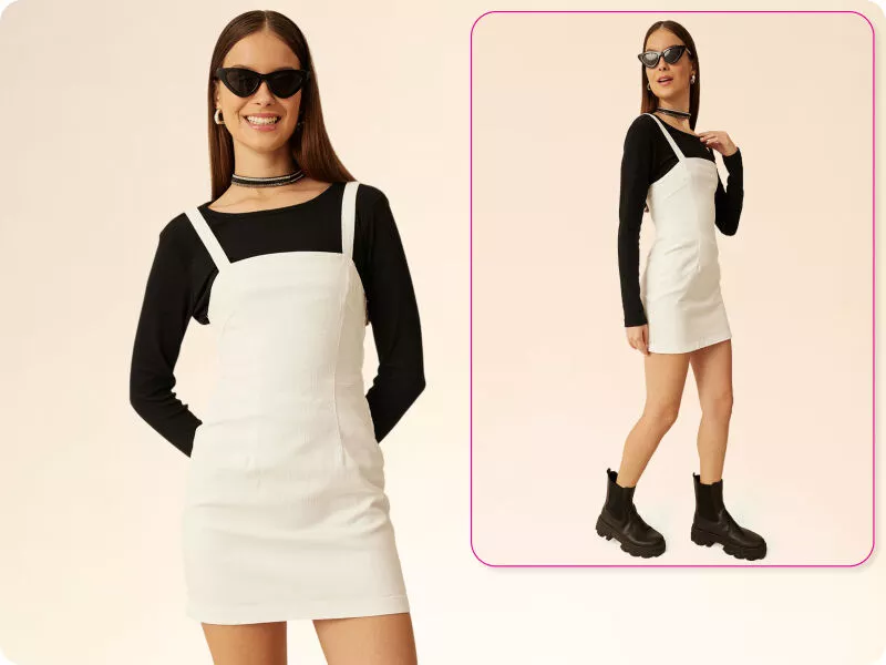 Modelo usando vestido branco sobre blusa preta
