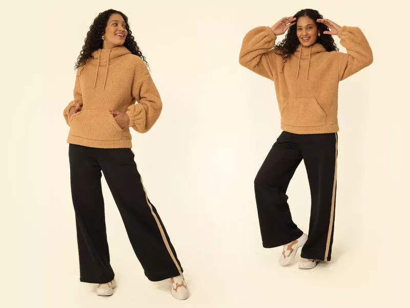 Mulher vestindo moletom peluciado e calça larga.