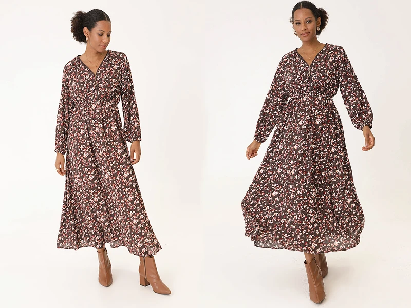 Vestido comprido floral castanho de manga comprida e botins. Look de senhora elegante para o outono.