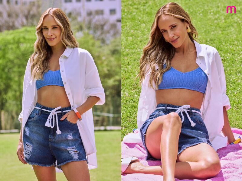 Mulher em look casual ao ar livre, com blusa branca e shorts.