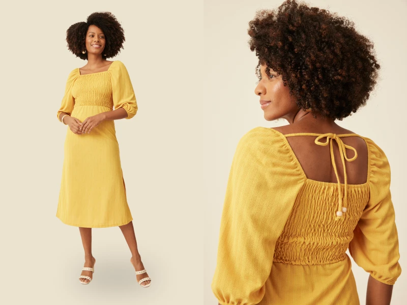 Mulher com cabelo afro em vestido midi amarelo de mangas abaloadas. Vista frontal e detalhe das costas com laço.