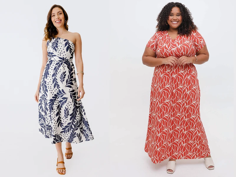 Duas mulheres com vestidos de verão: midi branco e azul de uma alça e comprido terracota com padrão de folhagem.