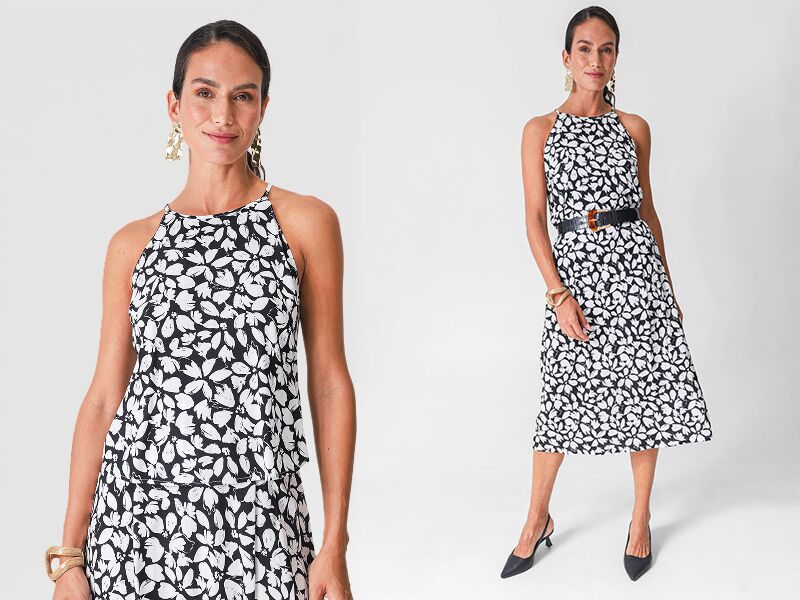 Modelo usando vestido preto e branco com estampas de borboletas